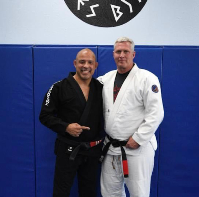 Picture of Chad Cleland with his professor Paul Nava when received his black belt.
